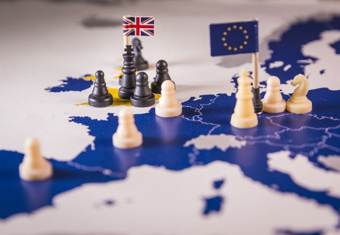 Chess pieces over an european map. Brexit concept