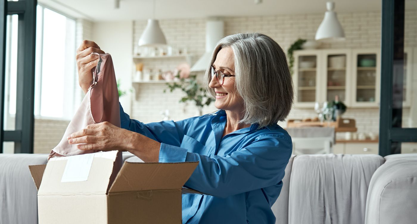 Happy,Middle,Aged,Woman,Buyer,Opening,Parcel,Box,At,Home.