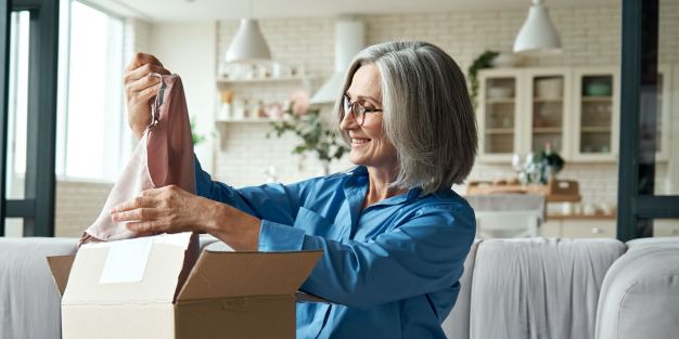 Happy,Middle,Aged,Woman,Buyer,Opening,Parcel,Box,At,Home.